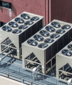 Industrial air conditioning units on top of modern building roof
